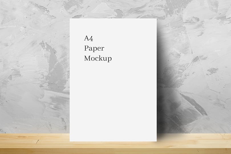 Photoshop A4 Paper Mockup Lean On Cement Textured Wall