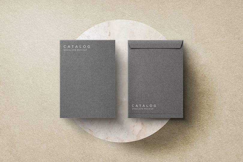 Photoshop Gray Envelope Catalog Mockup on Sand Podium