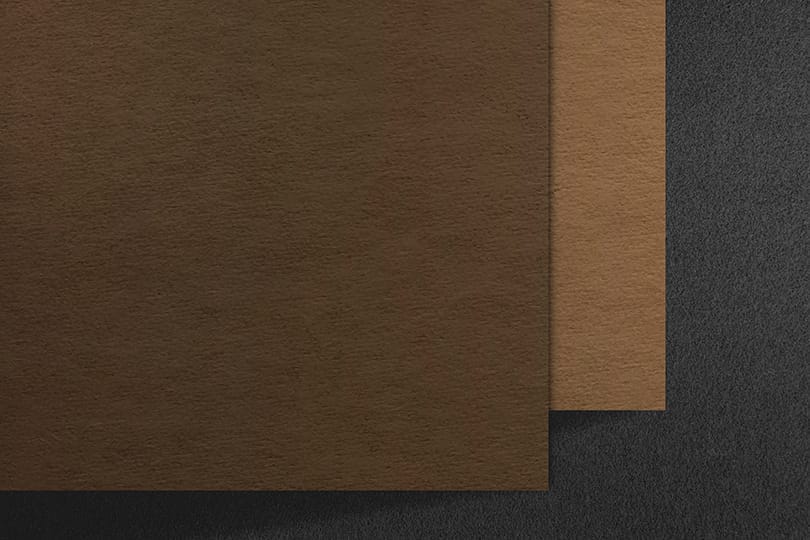 Image Brown Logo Mockup on Grey textured Background