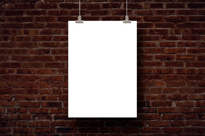 Image Hanging Poster Mockup on Red Brick Wall