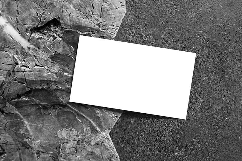 Image Business Card Mockup on Black Rock Background