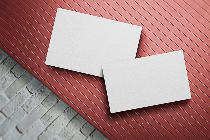 Image Postcard & Business Card Mockup on Red Board Pattern