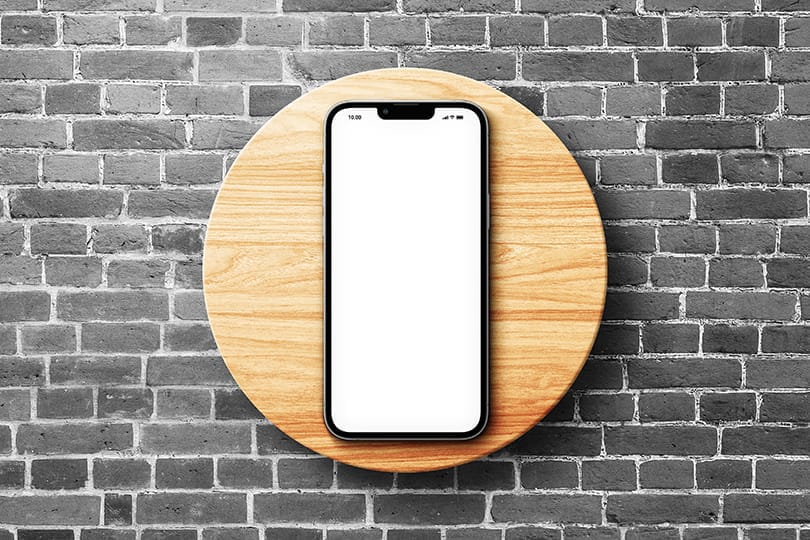 Image iPhone 13 Pro Mockup on Black Brick Wall