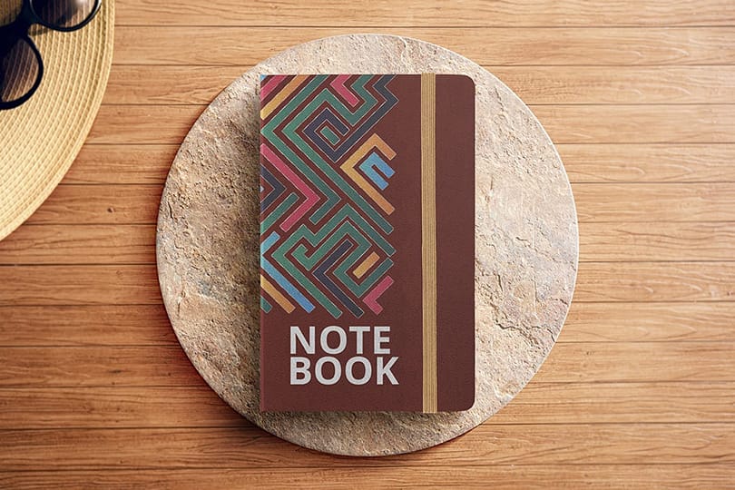 Photoshop Note Book Mockup with Caput Mortuum Color on Podium Background