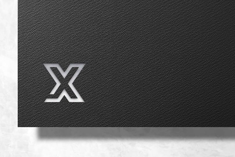 Photoshop X Debossed Logo Mockup on Black Textured Background