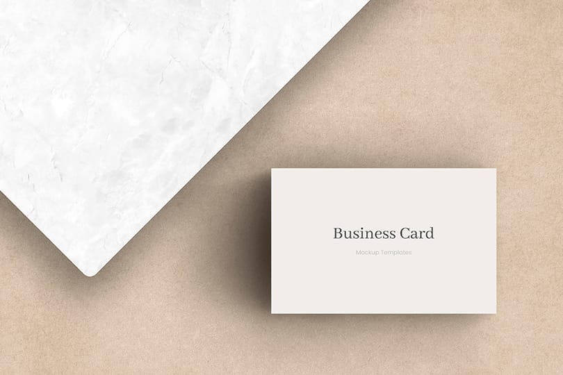 Business Card Mockup on Beige Background with White Pedestal