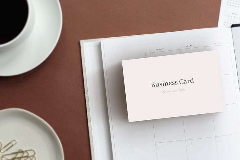 Business Card Mockup on Notebook Backdrop