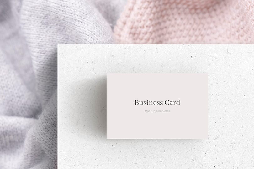 Business Card Mockup on White Paper & Knitted Fabric