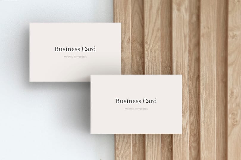 Image Two Business Card Mockup on Decorative Strip Wood Background