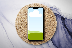 Canva iPhone 13 Pro Mockup on Rattan Podium