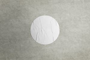 Image Rounded Sticker Mockup on Realistic Wall Texture