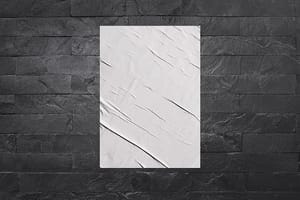 Image Wrinkled Poster Mockup on Black Stone Background