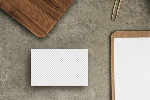 PNG Business Card On Grey Wall Texture With Wood & Paper Mockup