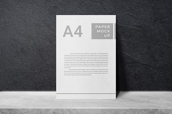 Photoshop A4 Paper Mockup On Rough Black Wall Texture